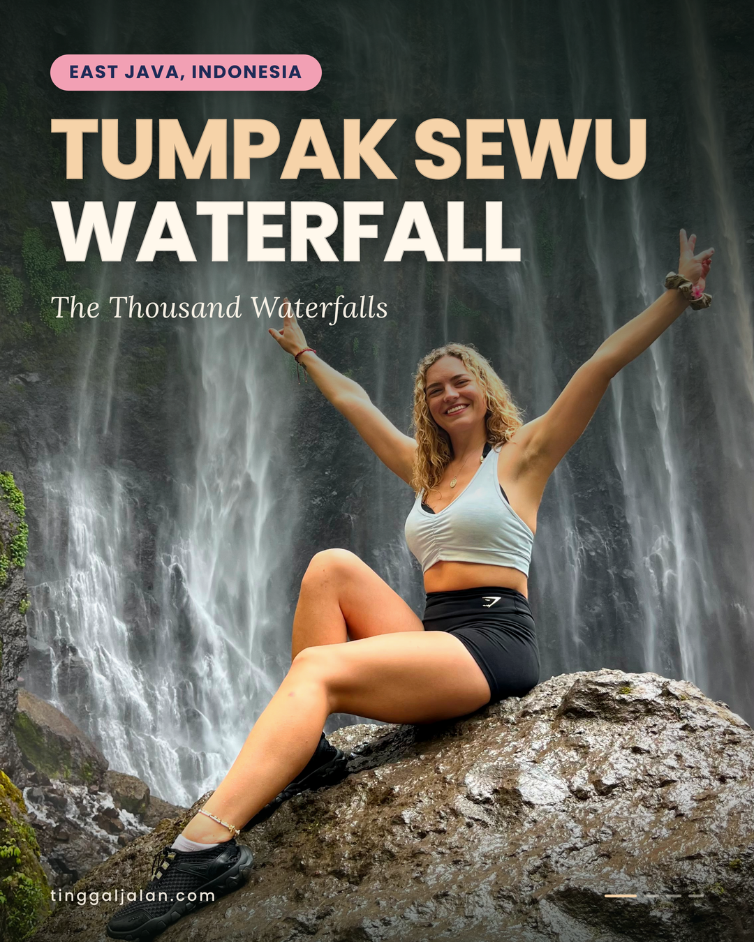 Travelers standing at the panoramic viewpoint overlooking the majestic Tumpak Sewu Waterfall in East Java, surrounded by lush tropical cliffs and cascading waterfalls.