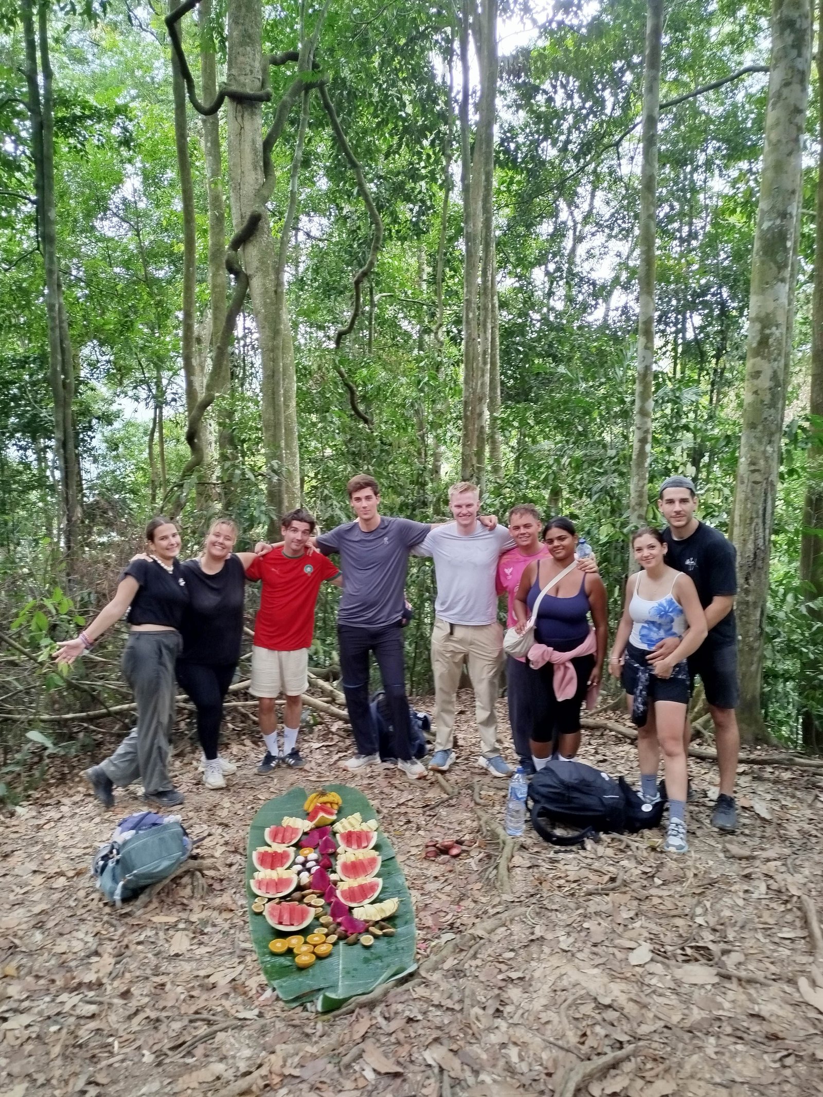 Hikers trekking through the Bukit Lawang rainforest during a 3 Days 2 Nights jungle adventure in Gunung Leuser National Park, Sumatra.