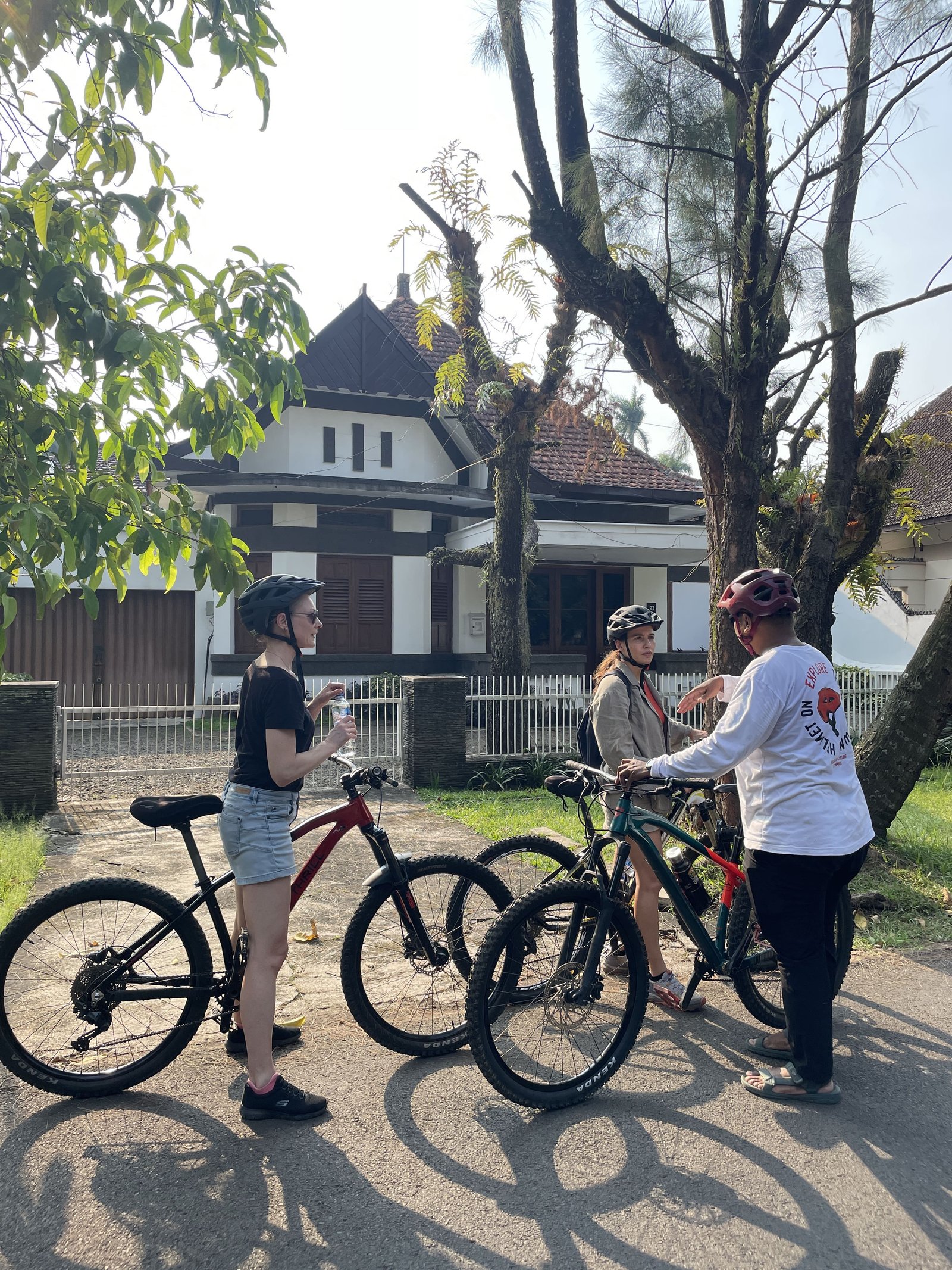 Travelers cycling through Malang City, exploring historic streets, local markets, colorful neighborhoods, and cultural landmarks on a guided city cycling tour."