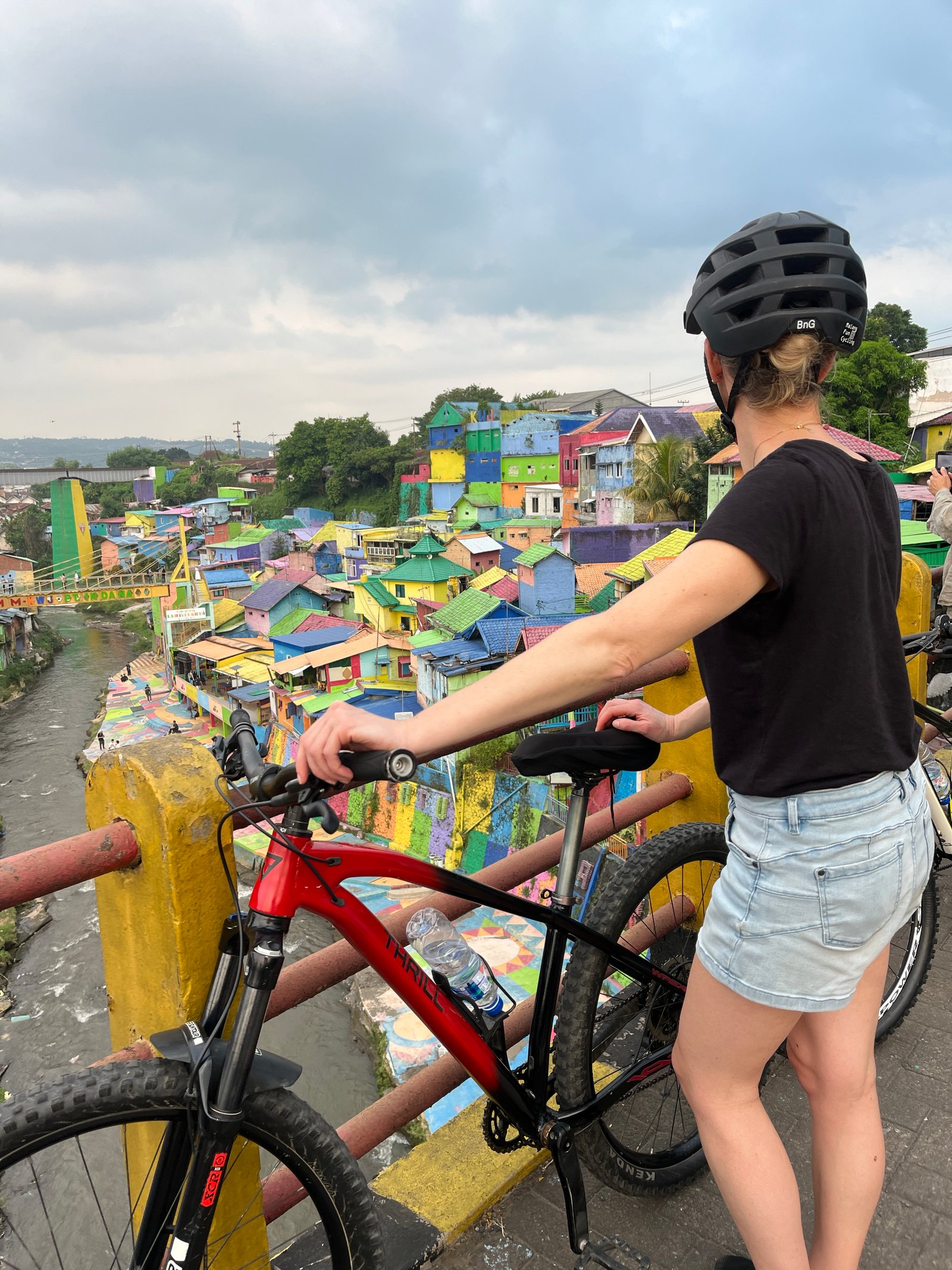 Travelers cycling through Malang City, exploring historic streets, local markets, colorful neighborhoods, and cultural landmarks on a guided city cycling tour."