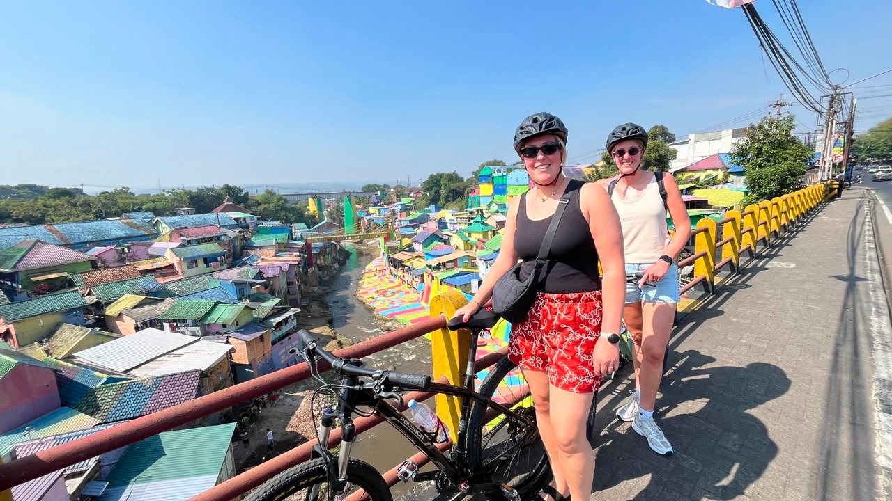 Travelers cycling through Malang City, exploring historic streets, local markets, colorful neighborhoods, and cultural landmarks on a guided city cycling tour."