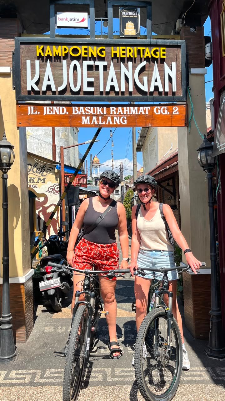 Travelers cycling through Malang City, exploring historic streets, local markets, colorful neighborhoods, and cultural landmarks on a guided city cycling tour."