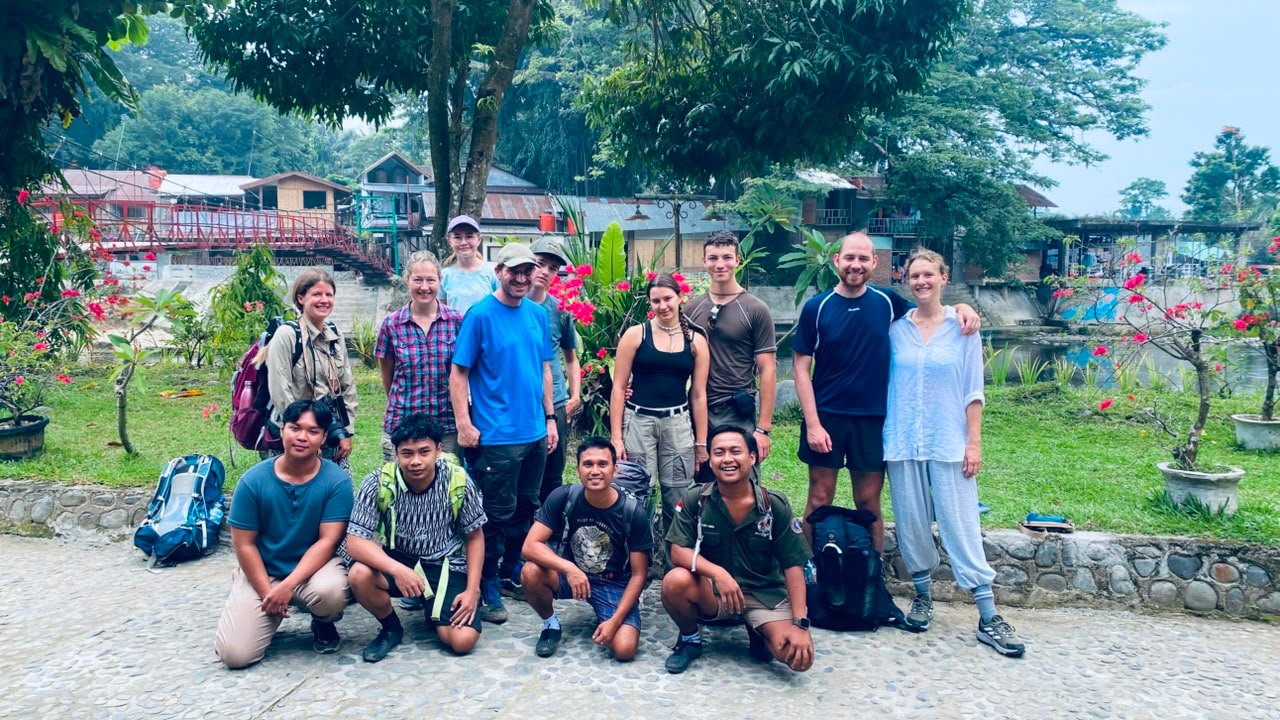 Hikers trekking through the Bukit Lawang rainforest during a 3 Days 2 Nights jungle adventure in Gunung Leuser National Park, Sumatra.